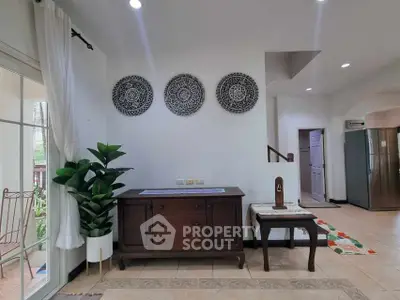 Charming interior with elegant decor and natural light, featuring stylish furniture and modern design elements.