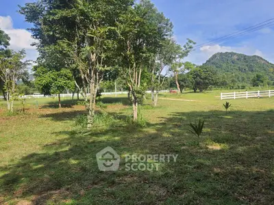 Scenic garden view with lush greenery and distant mountain backdrop