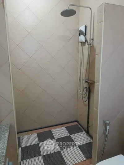 Modern bathroom with sleek shower design and tiled walls