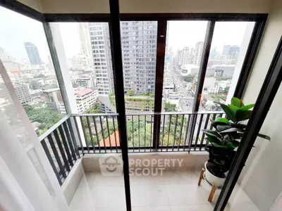 Stunning city view from modern high-rise balcony with glass railing