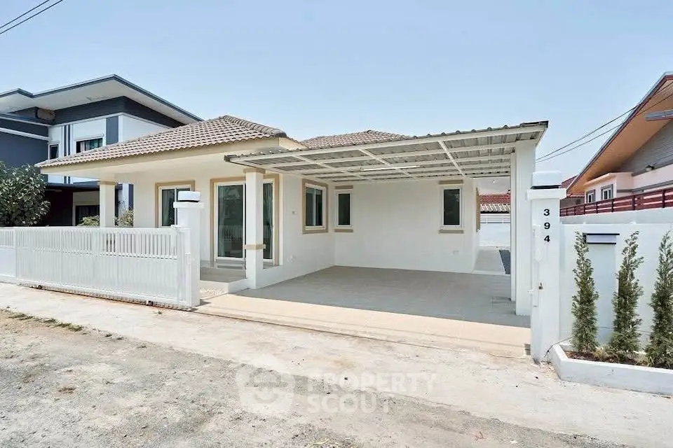 Charming single-story house with spacious carport and modern design in a serene neighborhood.