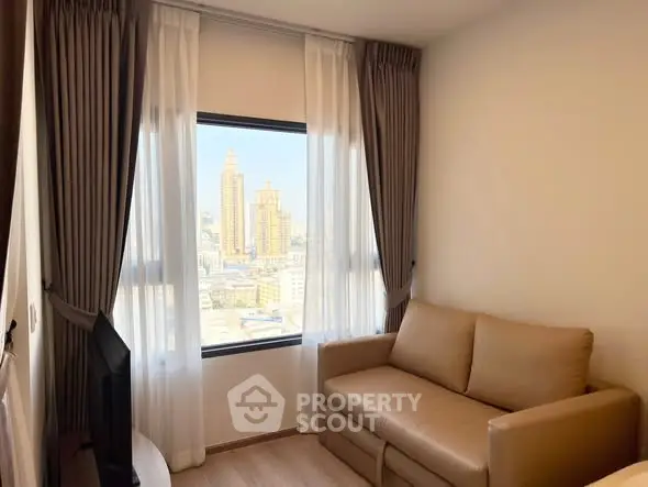 Cozy living room with city view, featuring a comfortable sofa and large window with curtains.