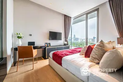 Luxurious bedroom with city view, modern decor, and elegant furnishings