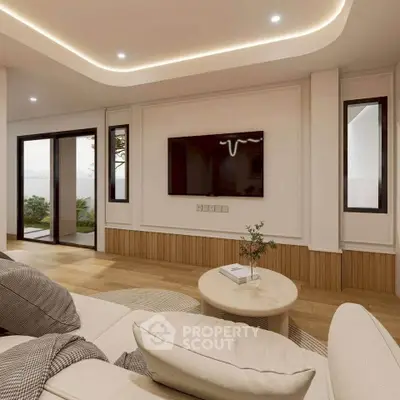 Modern living room with elegant lighting and cozy seating area, featuring a sleek wall-mounted TV.