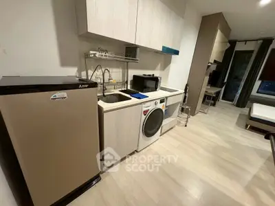 Modern kitchen with sleek appliances and open layout in a stylish apartment