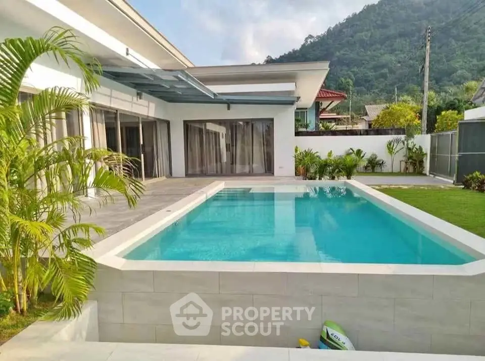 Luxurious modern villa with private pool and mountain views, perfect for relaxation and entertainment.