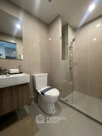 Modern bathroom with sleek design and glass shower enclosure