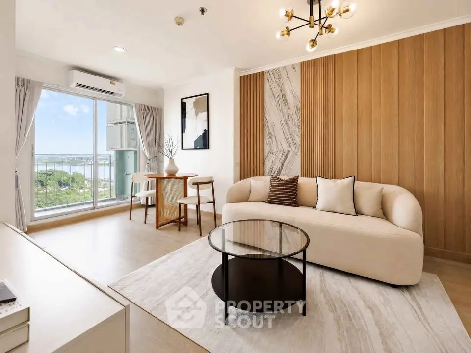 Modern living room with elegant decor and large window offering stunning views