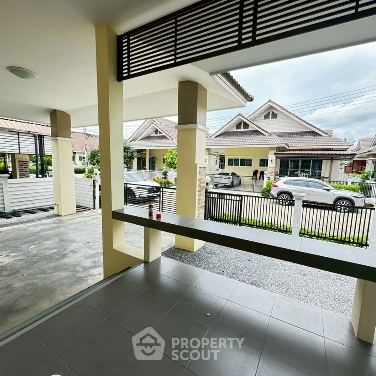 Charming suburban neighborhood with modern houses and spacious driveway.