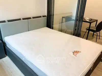 Modern bedroom with glass partition and stylish furnishings