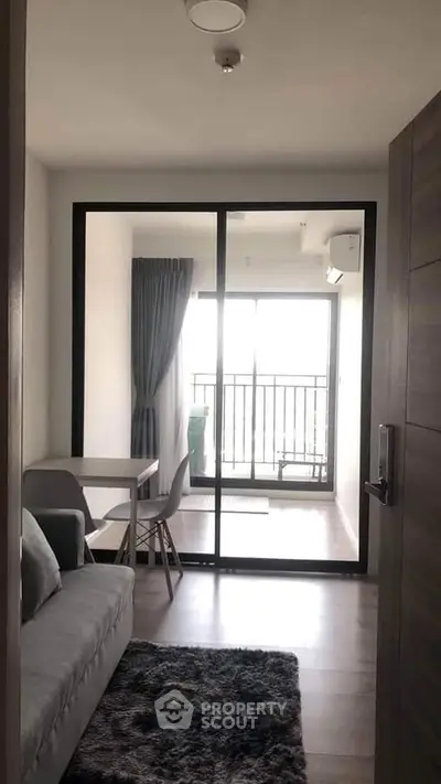 Modern apartment with cozy living area and balcony view