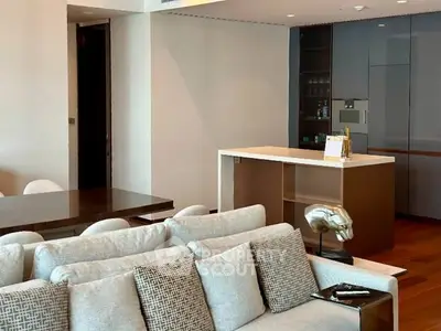 Modern open-plan living room with sleek kitchen and stylish decor