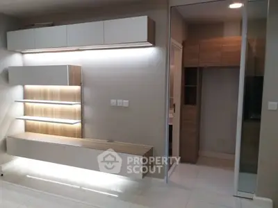 Modern living room with sleek built-in storage and ambient lighting