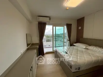 Modern bedroom with balcony and scenic view in a stylish apartment