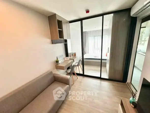 Modern compact living room with sliding glass doors and cozy decor