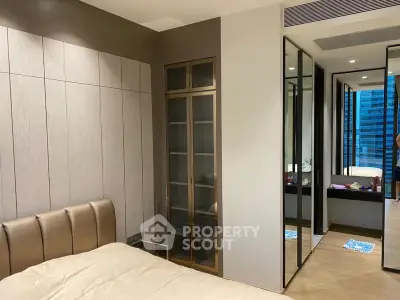 Luxurious modern bedroom with mirrored closets and elegant decor
