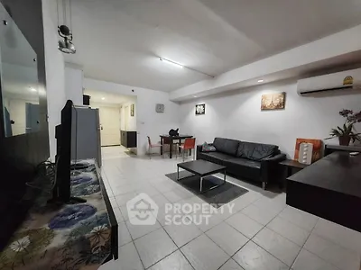 Spacious living room with modern furniture and open layout