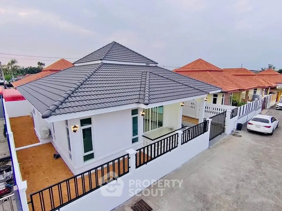 Charming suburban house with modern roof and spacious driveway