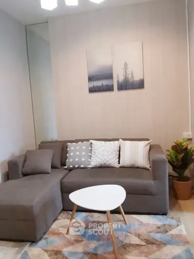 Cozy living room with modern gray sofa and stylish decor