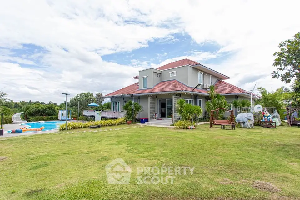 Spacious suburban home with lush garden and inviting pool, perfect for family living.
