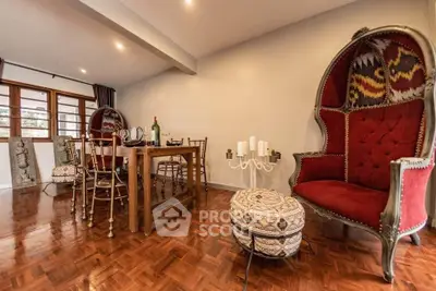 Elegant dining room with unique chairs and polished wooden floors
