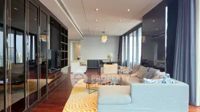 Luxurious modern living room with elegant decor and city view, featuring plush sofa and stylish lighting.