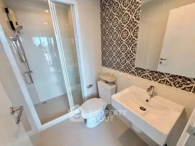 Modern bathroom with stylish tile design and spacious shower area