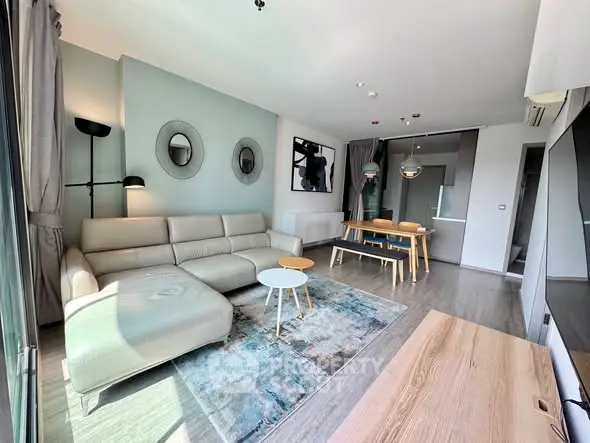 Modern living room with stylish decor and ample natural light