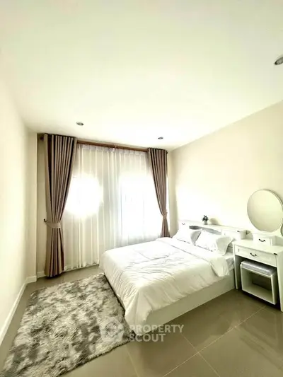 Bright and cozy bedroom with elegant curtains and plush rug