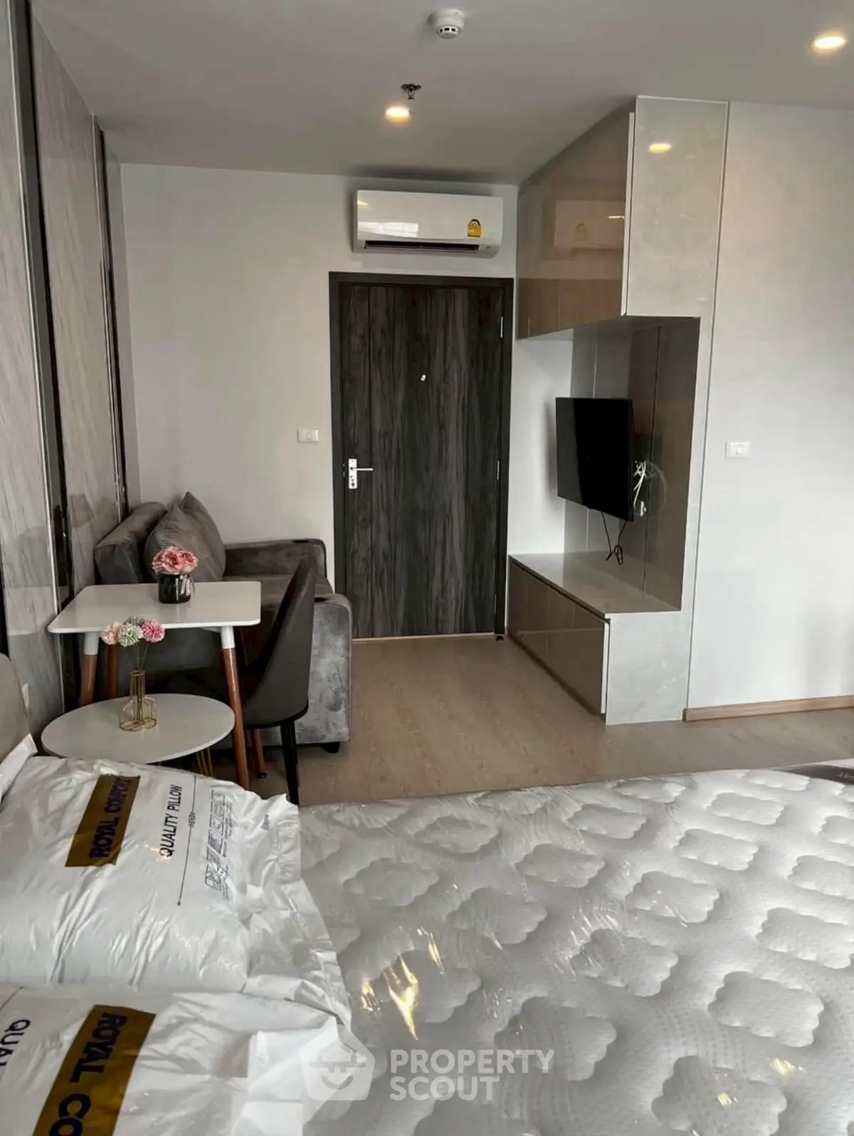 Modern studio apartment with cozy living area and stylish decor