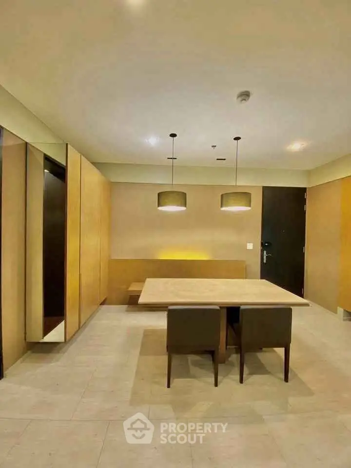 Modern dining area with minimalist design and elegant lighting