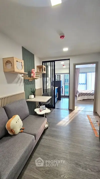 Modern living room with stylish decor and cozy ambiance, featuring a plush sofa and unique wall shelves.