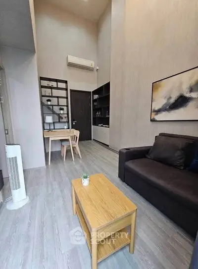 Modern living room with high ceiling and stylish decor