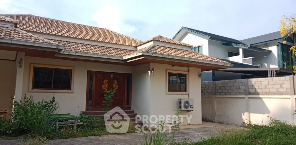 Charming suburban house with tiled roof and spacious front yard