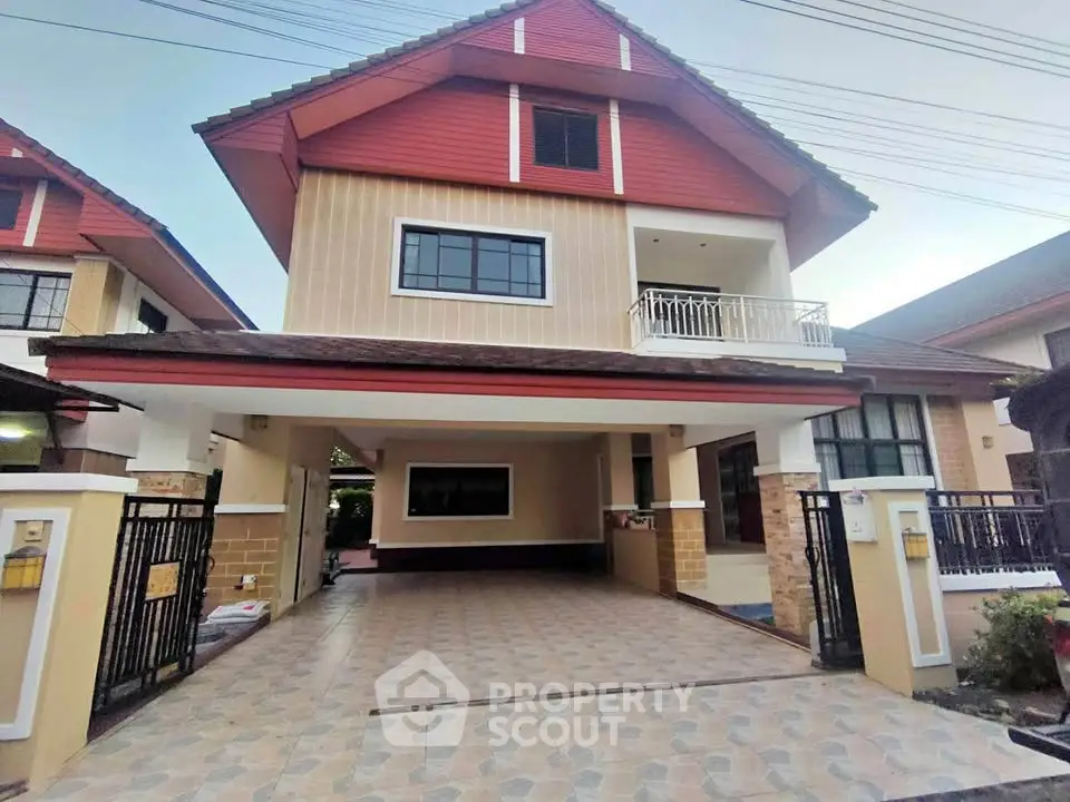 Charming two-story house with spacious driveway and balcony in a serene neighborhood.