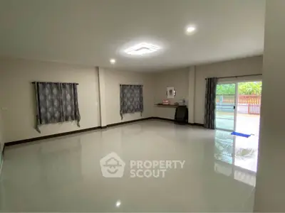 Spacious empty living room with large windows and glossy tiled floor, perfect for customization.