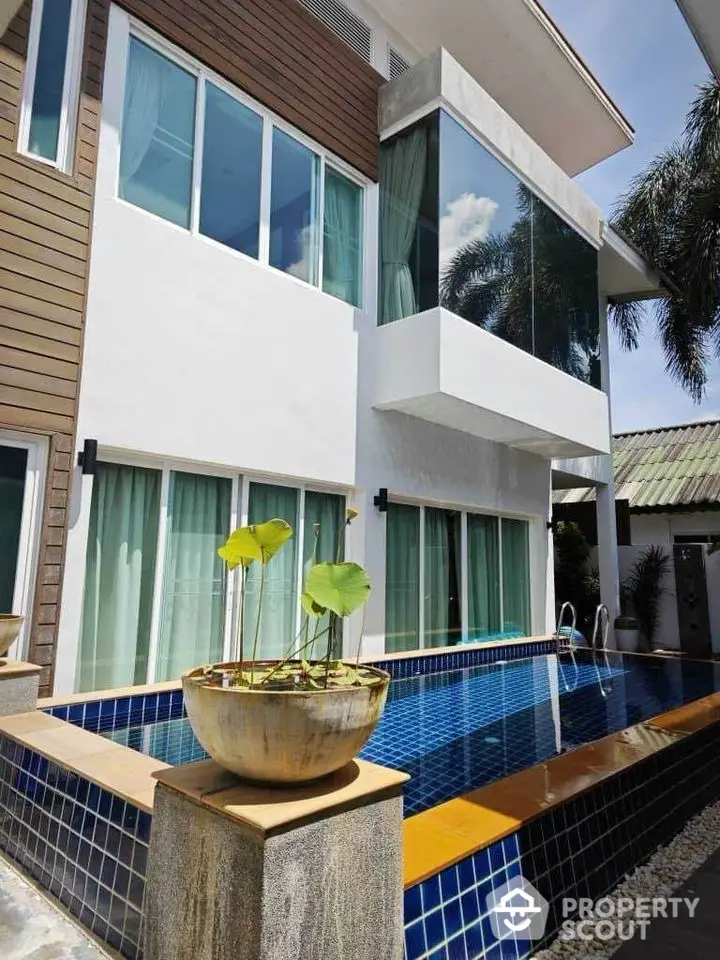 Modern two-story house with private pool and large windows