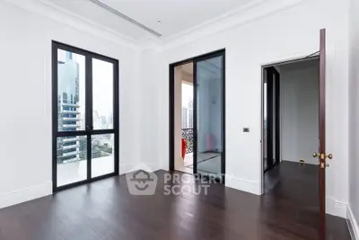 Spacious modern apartment with floor-to-ceiling windows and city view