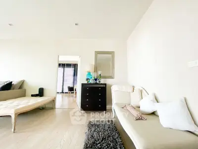 Spacious living room with elegant decor and natural light