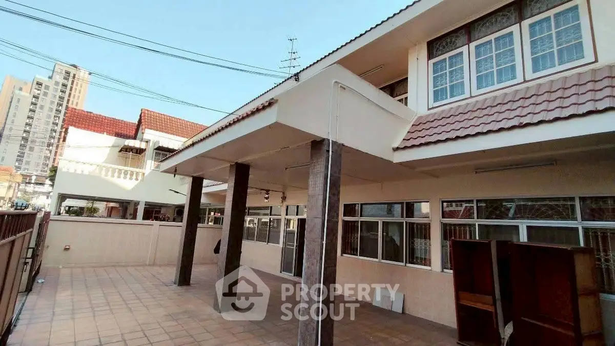 Spacious residential property with tiled patio and modern architecture.