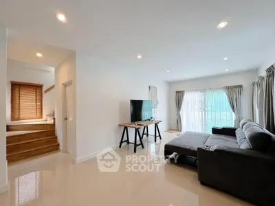 Spacious modern living room with sleek furniture and natural light