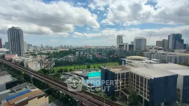 Stunning cityscape view with modern buildings and lush greenery, perfect for urban living.