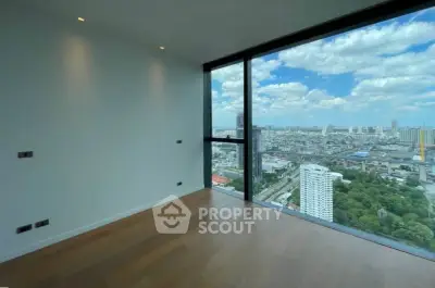 Spacious corner unit with floor-to-ceiling windows offering a stunning cityscape view.