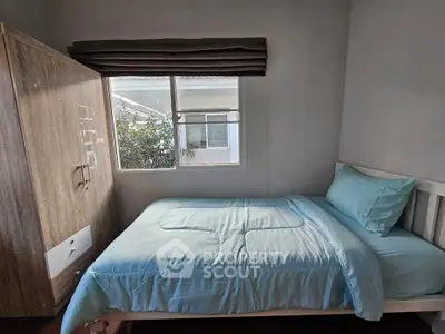 Cozy bedroom with natural light and modern furnishings, perfect for relaxation and comfort.