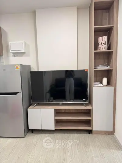 Modern living room with sleek TV unit and stylish shelving