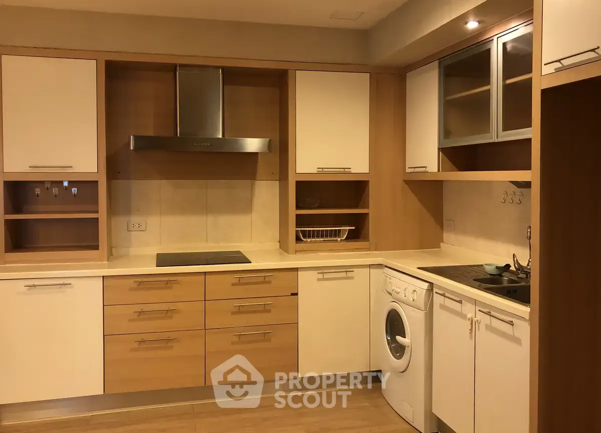 Modern kitchen with integrated appliances and sleek cabinetry