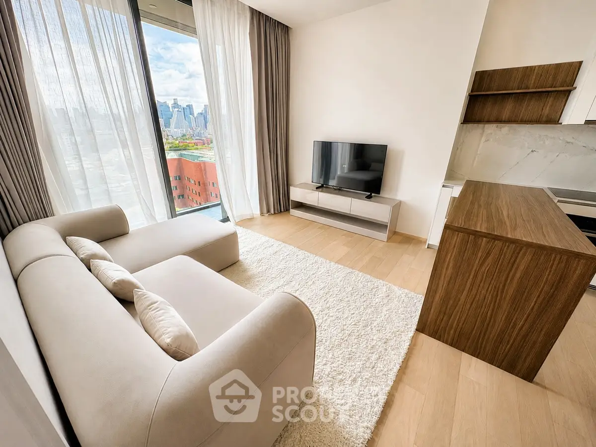 Modern living room with city view, featuring sleek furniture and natural light.