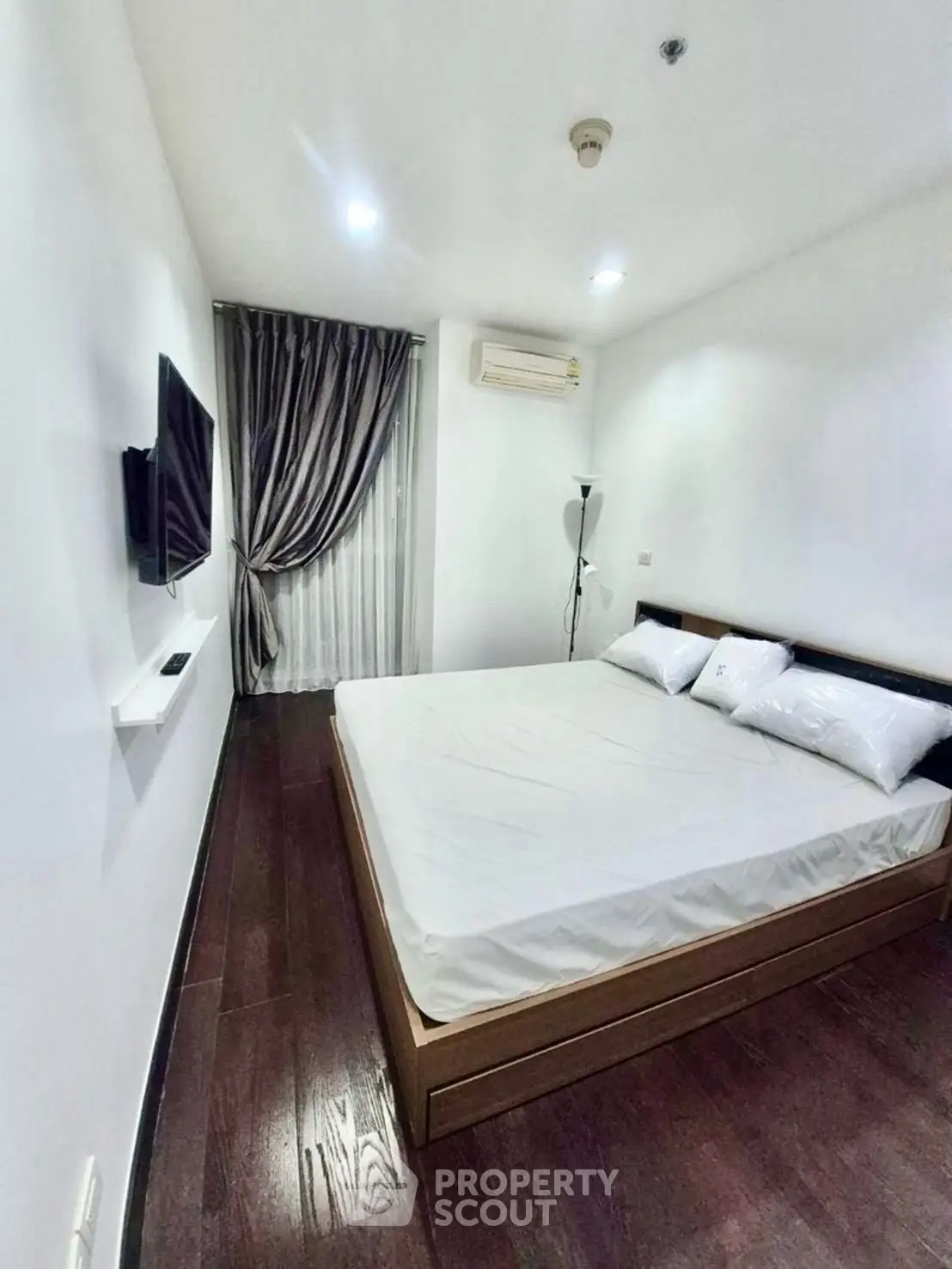 Modern minimalist bedroom with sleek design and cozy ambiance
