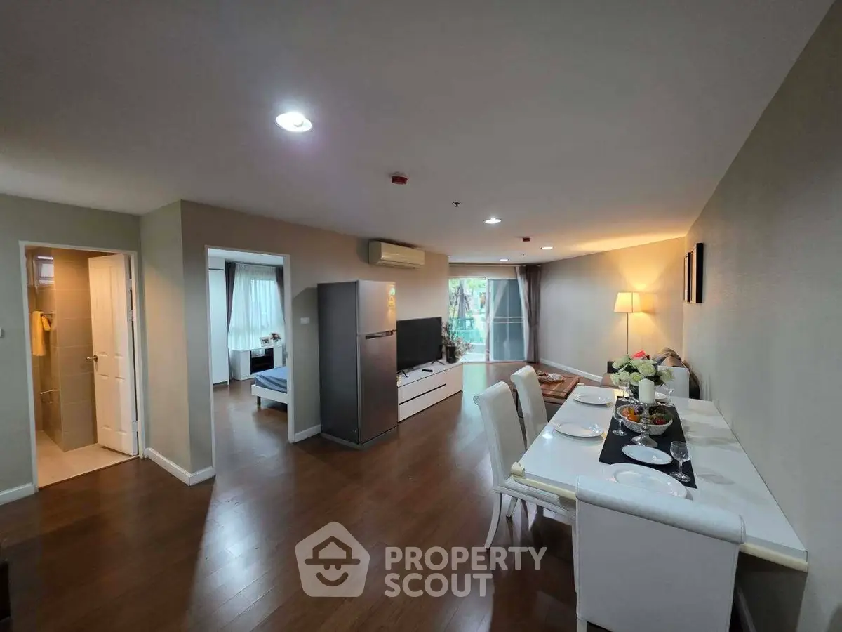 Spacious open-plan living room with dining area and modern decor