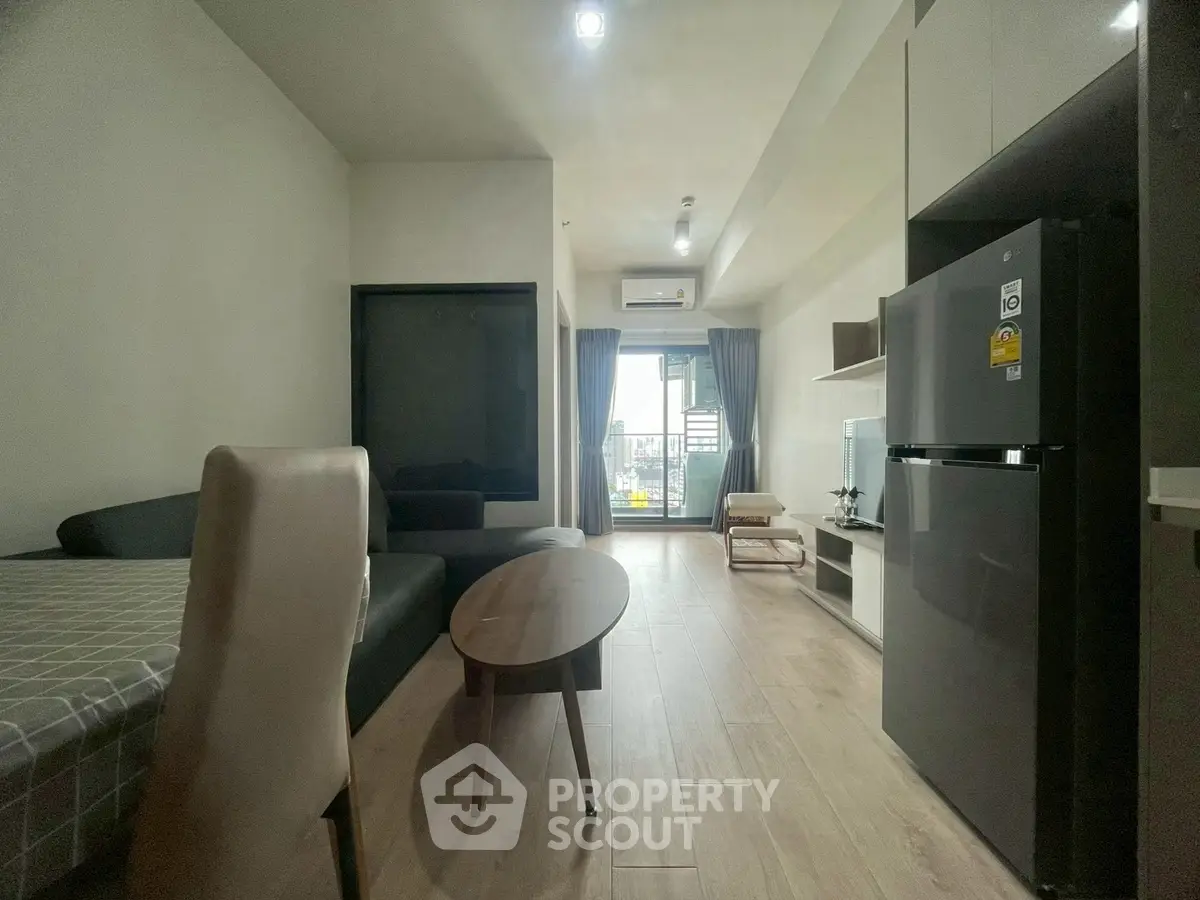 Modern living room with open layout and balcony view in stylish apartment
